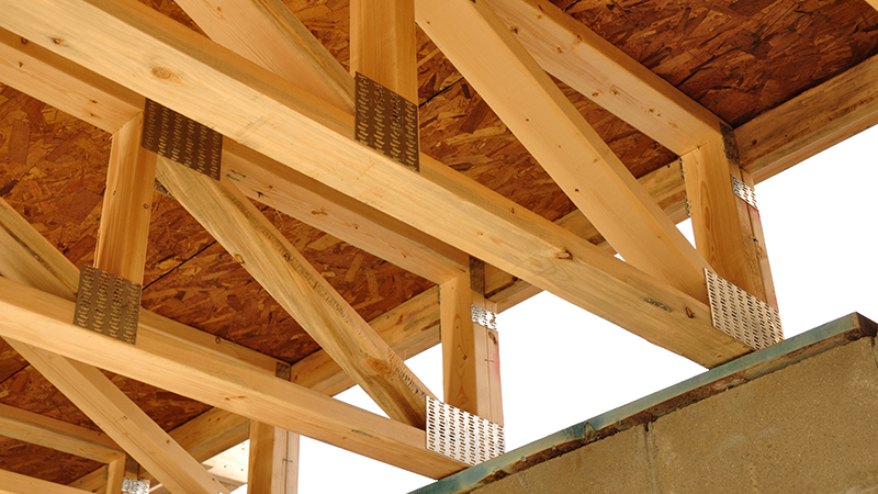 Trusses Above Basement of House at Construction Site as seen during home inspection services